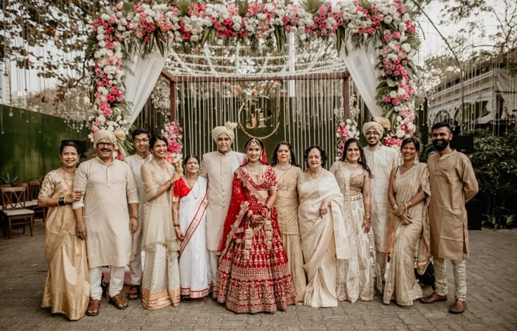 Traditional wedding photography capturing family portraits during Indian wedding rituals.
